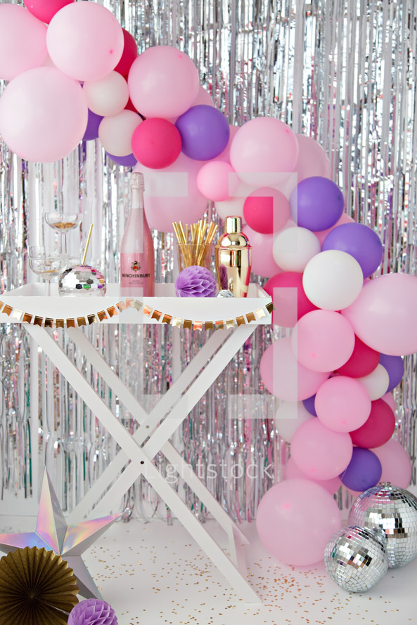 champagne and balloon arch 