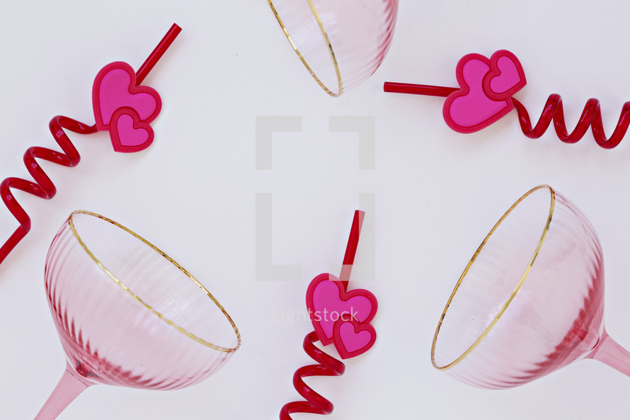 champagne glasses and heart straws 