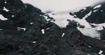 Rugged Mountain Hikes Of Glaciar Vinciguerra In Ushuaia, Tierra del Fuego Province, Argentina. Aerial Pullback Shot