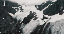 Snowy Rocky Mountains Of Glaciar Vinciguerra In Ushuaia, Tierra del Fuego Province, Argentina. Aerial Drone Shot
