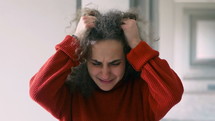 stressed female pulling her hair 