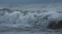 Winter waves crashing on the ocean shore
