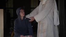 Jesus Christ in white robe or spiritual angel comforts a young man, teenage boy.