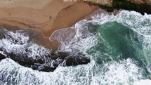 Birds Eye view looking down Aerial Cinematic drone rugged coastline cliffs Santa Cruz 