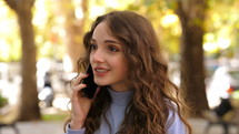 a young woman talking on a cellphone 