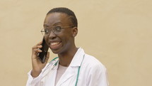 a doctor talking on a cellphone 