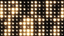 Golden flashing lights wall stage background. Abstract cinematic lights bulb spotlight. Led display blinking lights VJ 