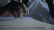 a man working filling out documents 