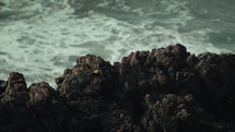Coastal cliffs with incense sticks in the middle. Static and slow motion shot