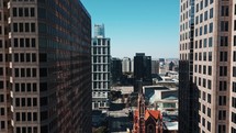 Drone Aerial of Pearl Street and Buildings Below in Downtown Dallas, Texas	
