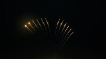Brightly colorful fireworks for New Year and other events celebration on dark background. Seamless looping 4k
