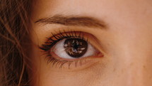 female's blinking eye 