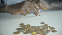a man counting coins 