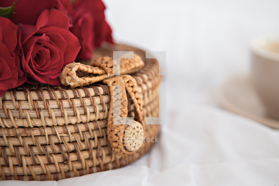 red roses on a woven basket 