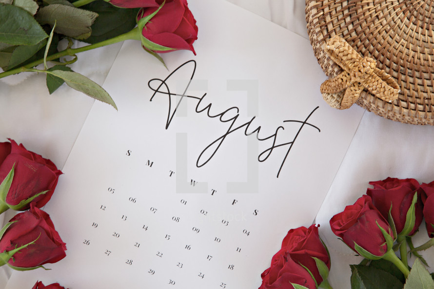 red roses on a calendar of August 