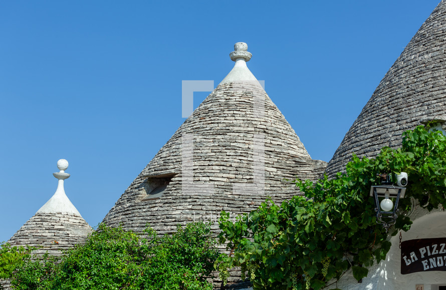 Traditional trulli houses with conical roofs made of stone, a unesco world heritage site in alberobello, puglia, italy, are attracting tourists from all over the world