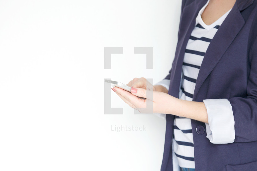 a woman holding her cellphone 