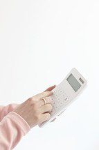 a woman holding a calculator 