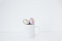 pastel gold speckled Easter eggs in a mug 