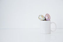 pastel gold speckled Easter eggs in a mug