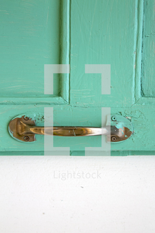 teal door and door pull 