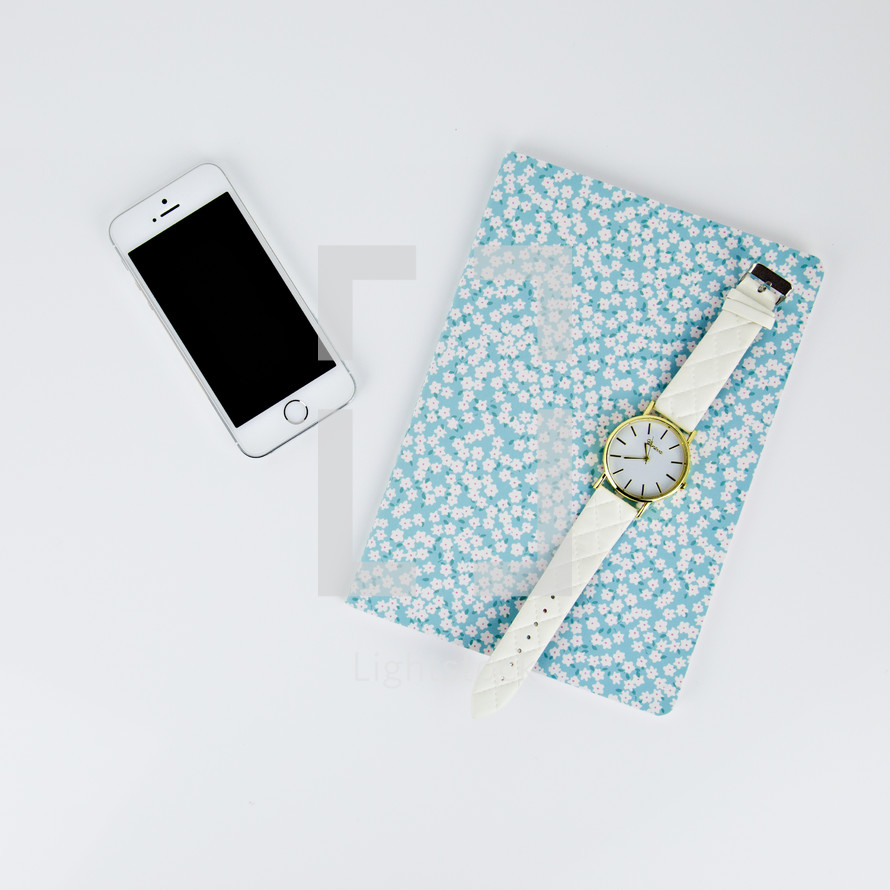 watch, iPhone, and floral planner 