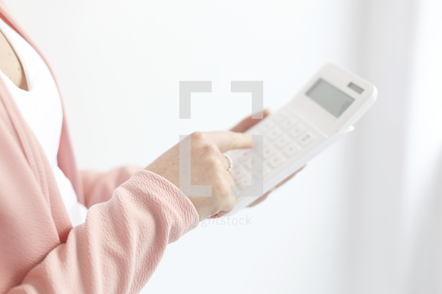 a woman holding a calculator 