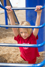 a child playing on a playground 
