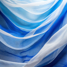 draped blue and white woven fabrics