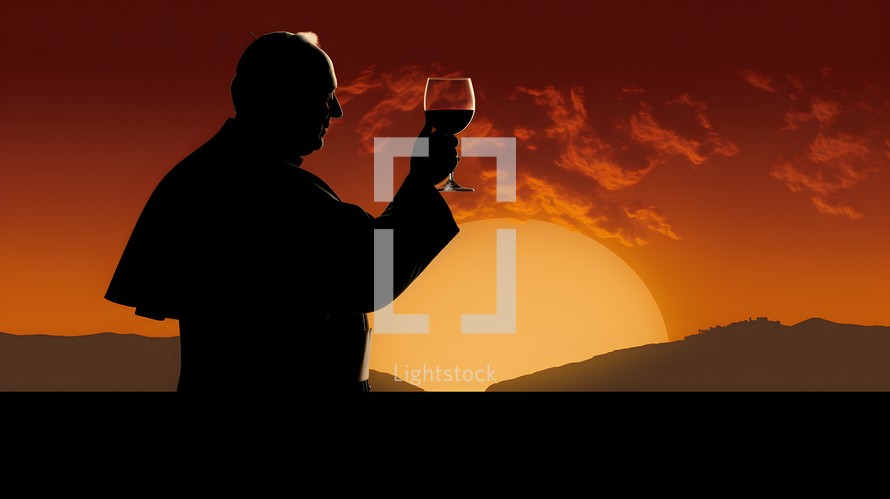 Pope with communion glass at sunset