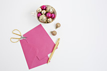 fuchsia and gold ornaments and stationary 