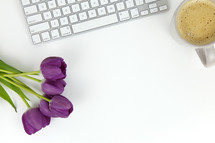 keyboard, coffee, and purple tulips 