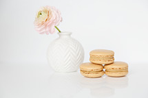macaroons and flower in a vase 