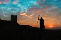 Prophet of the Old Testament going to a fortress at sunrise. Biblical concept.
