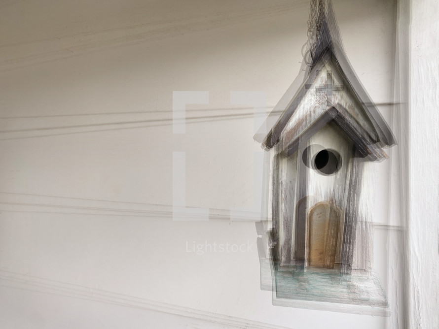 out of focus in motion birdhouse multiple exposure