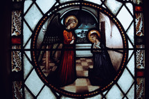 stained glass window of angel and Mary 