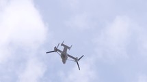 V22 Osprey aircraft with rotors in slow motion flight