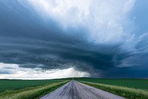 Dramatic Dark Storm Clouds Over A Peaceful Country Road