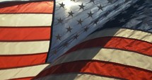 Closeup of American flag in sunlight.