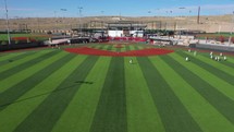 Baseball field with warm up players in Albuquerque New Mexico