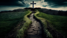 A path to a cross in a field