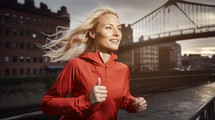 AI Generated Image. Beautiful blond woman running in the city street