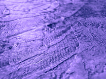 Purple texture viewed on an angle, with shallow focus
