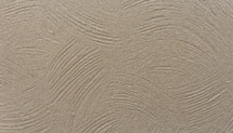 rough background surface in beige with curved, scraped lines