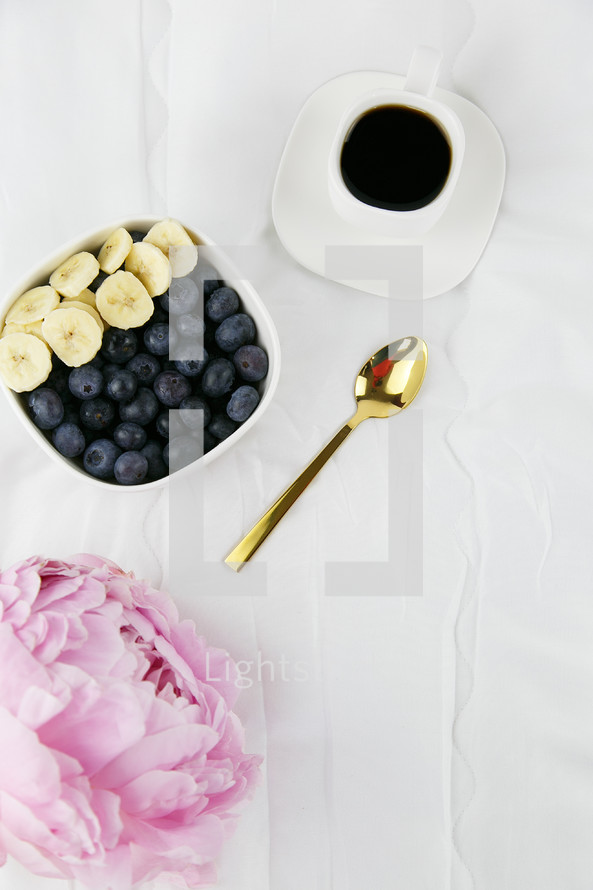 peonies and bowl of fruit with coffee 