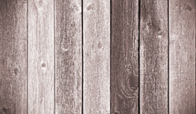 Weathered fence panel in brown with slight vignette