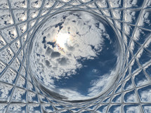 sun and clouds in the sky viewed through faceted glass with center sphere effect