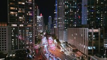 Downtown Miami with Traffic on Brickell Avenue at Night