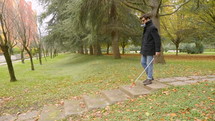 blind man walking in a park 