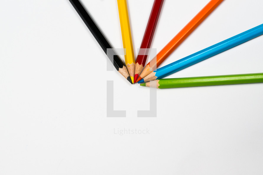 colored pencils on white background 